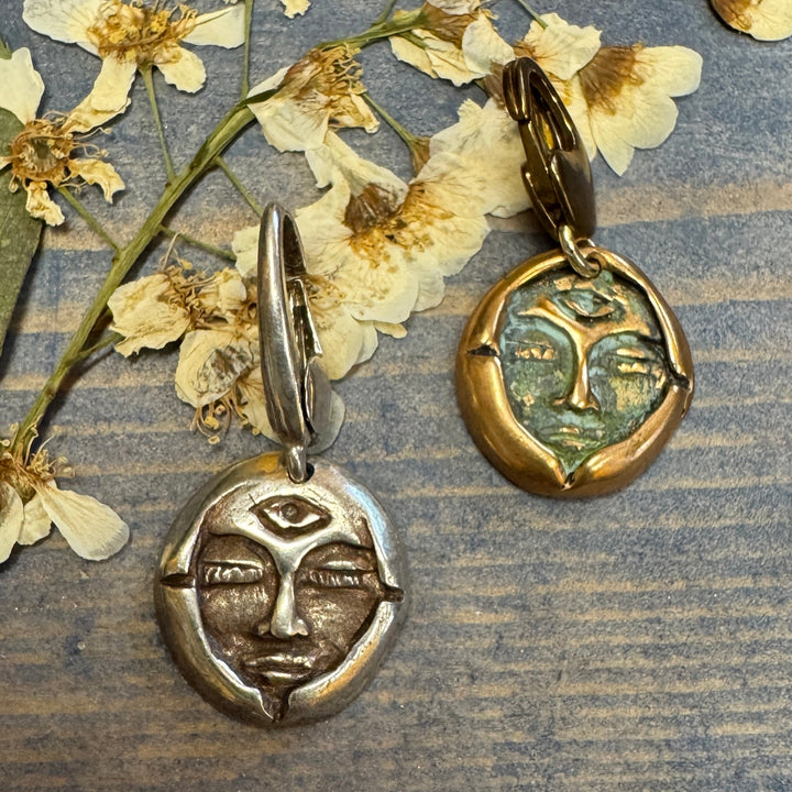 bronze and silver emerge tag on dried flowers