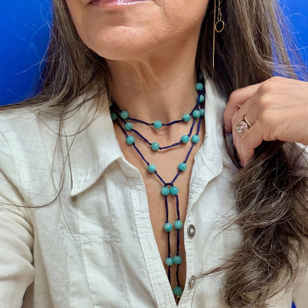 Woman wearing meditation backbeads in amazonite