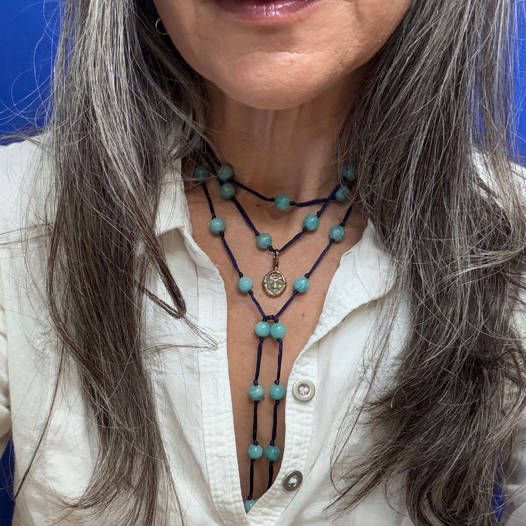 amazonite backbeads on model with emerge bronze charm layered necklace