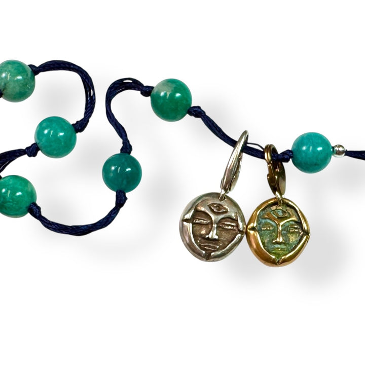 amazonite with silver and bronze emerge charms on white background