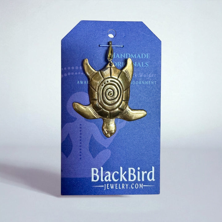 Gold turtle pendant on a Blue BlackBird Jewelry card