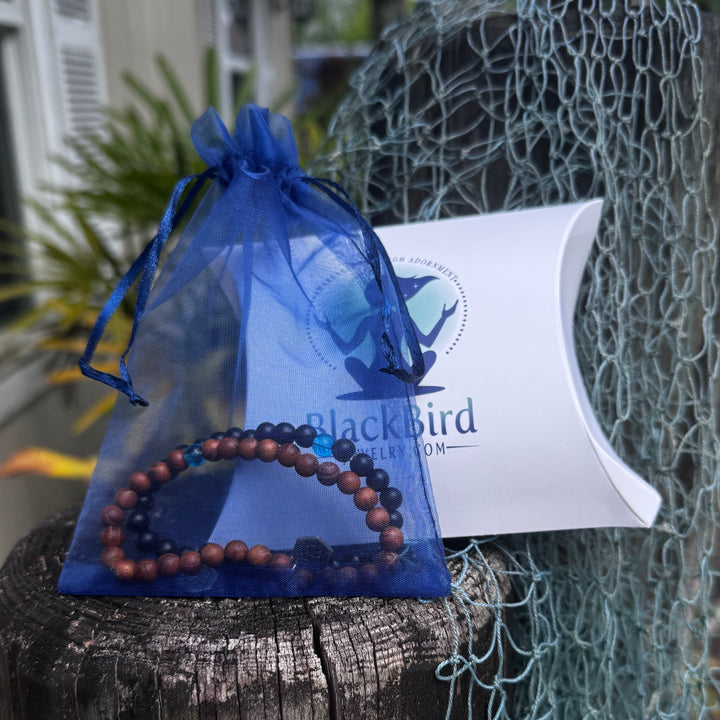 two blue mind bracelets in a blue bag with gift box