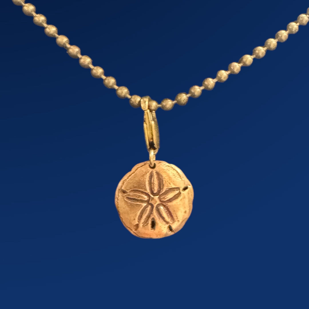 gold sand dollar chain on chain on blue background