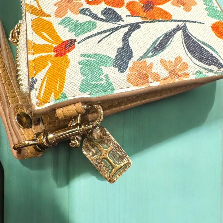 floral purse with tao earth charm on turquoise table