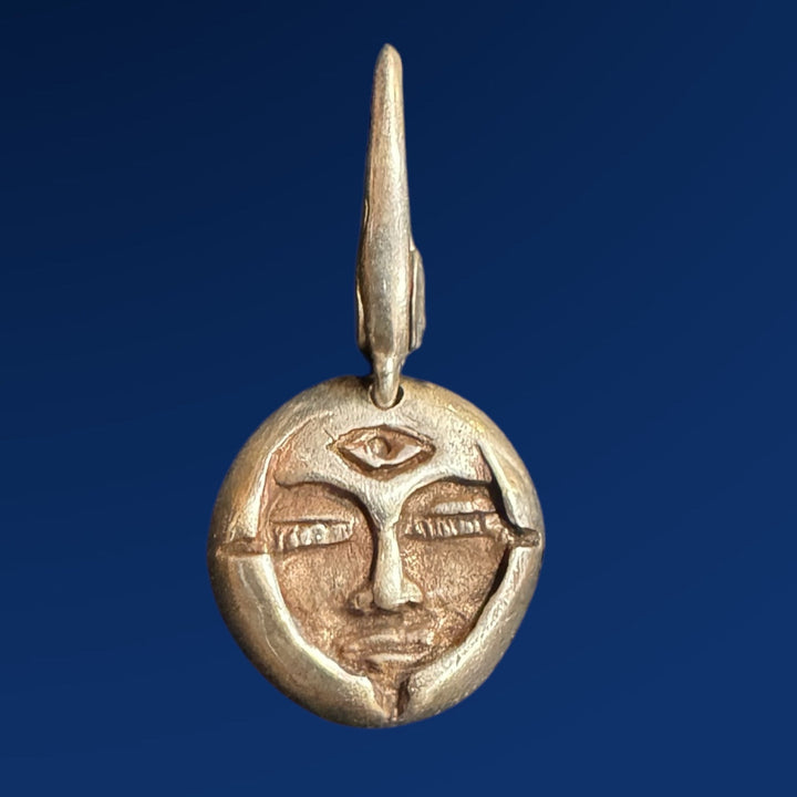 silver emerge charm on blue background