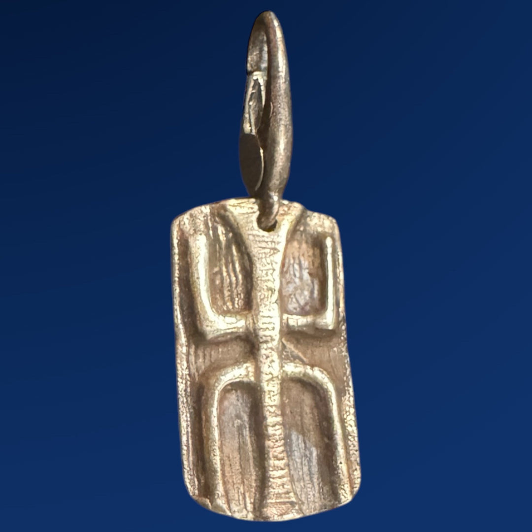 tao wood silver charm on blue background