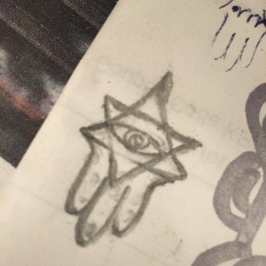 sketch book illustration of the star hamsa charm with evil eye protection