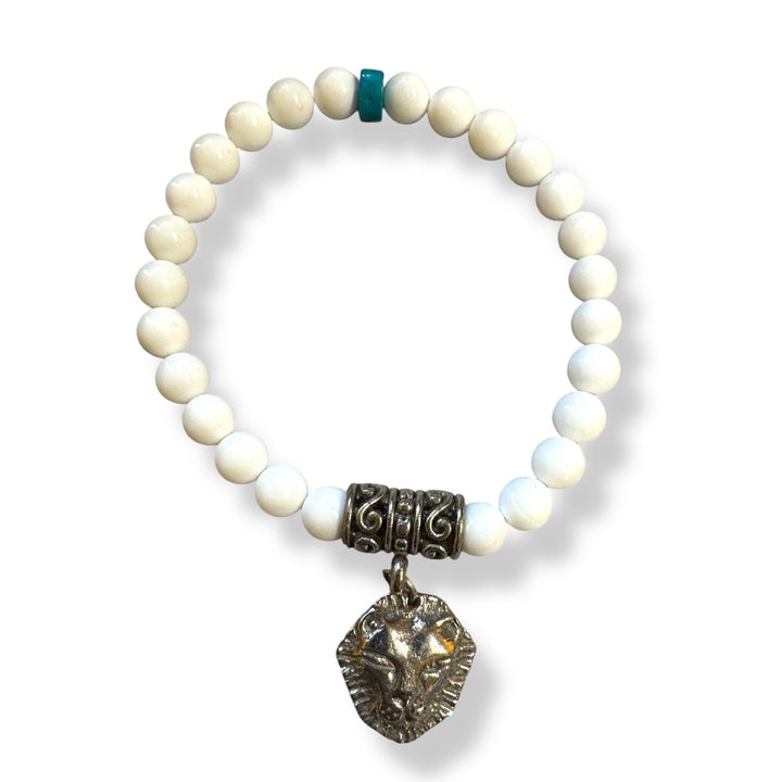 white shell and bronze lion bracelet with turquoise