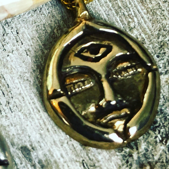 bronze emerge face charm 
