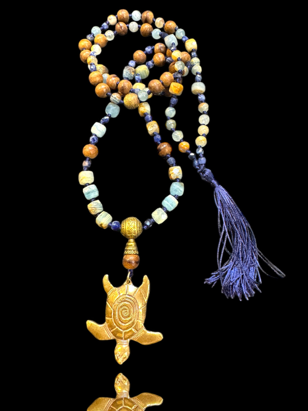 bronze sea turtle mala with gemstones and tassle
